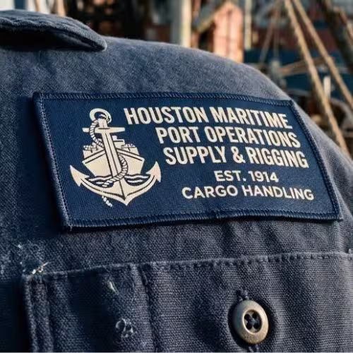 Custom navy blue patch on a ship worker's uniform.