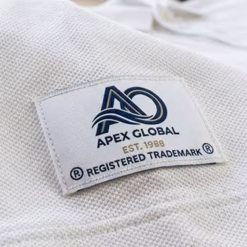 Clean custom patch on a white polo shirt.