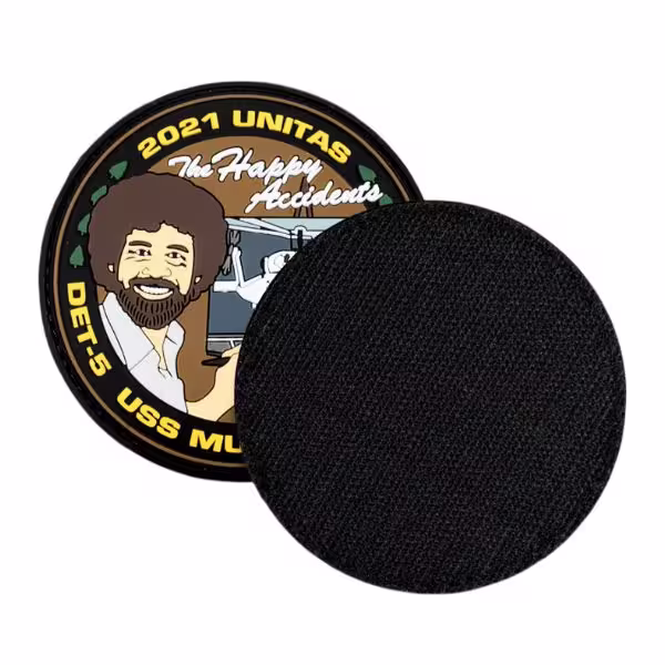 A round custom patch displaying a black hook-and-loop Velcro backing.
