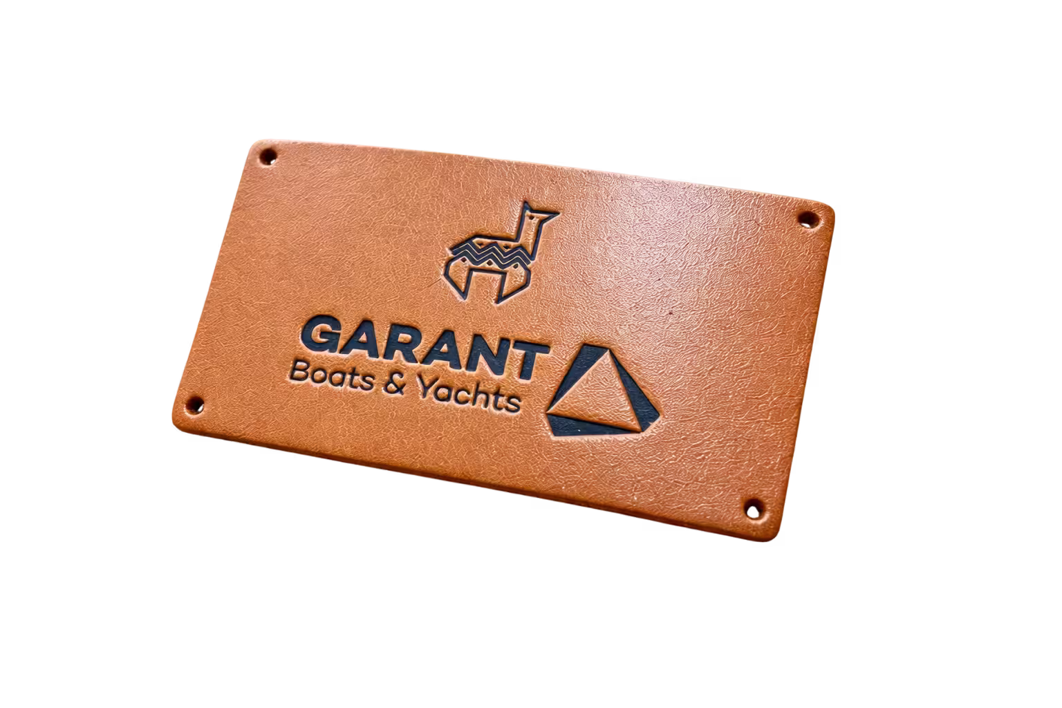 Custom debossed leather patch featuring recessed Garant Boats and Yachts logo.