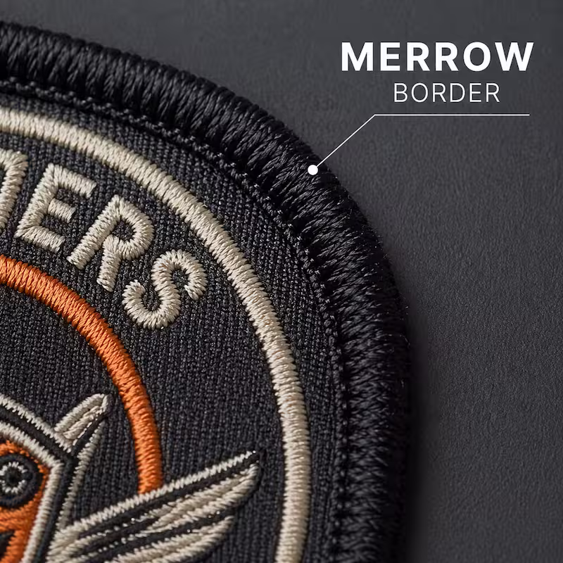 Close-up of a custom embroidered patch highlighting the thick, overlocked stitching of a traditional merrow border.