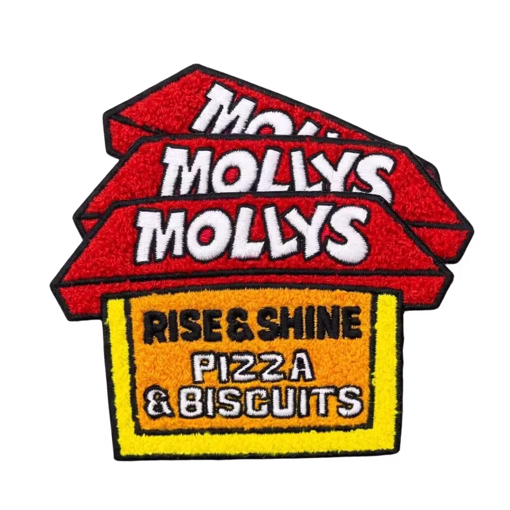 Stacked custom chenille patch for Molly's Rise & Shine Pizza & Biscuits featuring textured red and yellow lettering.
