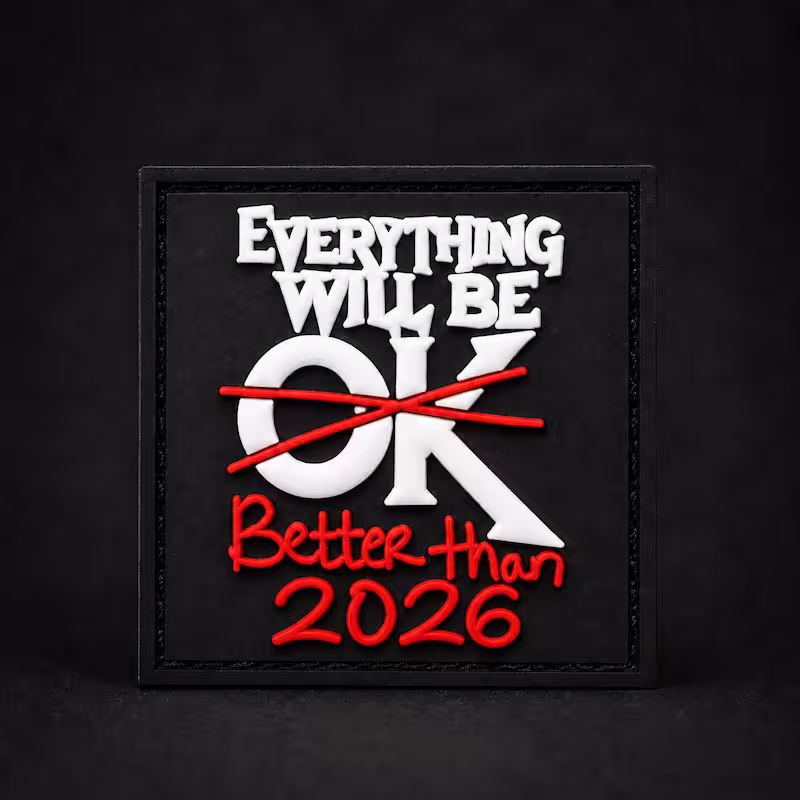 Square black PVC patch with raised text stating Everything Will Be OK crossed out and replaced with Better Than 2026